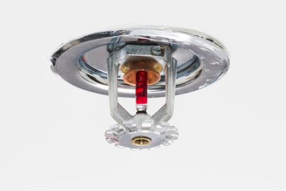 Close-up of a ceiling-mounted fire sprinkler head